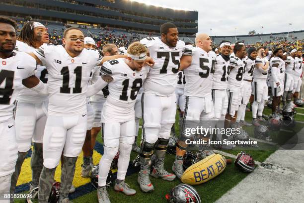 Ohio State players sing Carmen Ohio at the conclusion of the game between the Ohio State Buckeyes and the Michigan Wolverines on November 25, 2017 at...