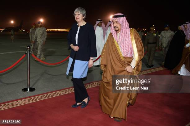 British Prime Minister Theresa May is greeted by the Governor of Riyadh Province Faisal bin Bandar Al Saud at King Abdul Aziz airport on November 29,...