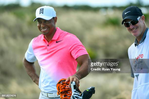 Tiger Woods has a laugh with his caddy Joe LaCava during practice for the Hero World Challenge at Albany course on November 29, 2017 in Nassau,...