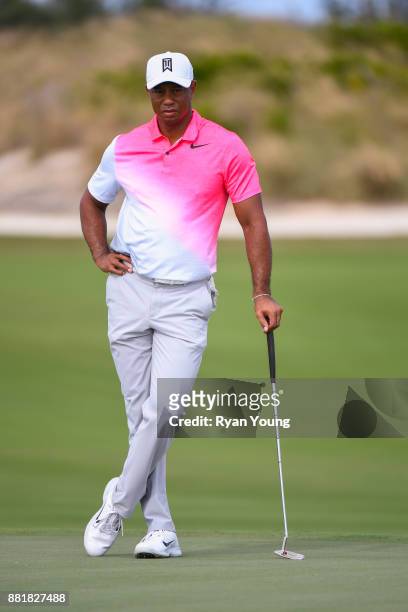 Tiger Woods watches his playing partners during practice for the Hero World Challenge at Albany course on November 29, 2017 in Nassau, Bahamas.