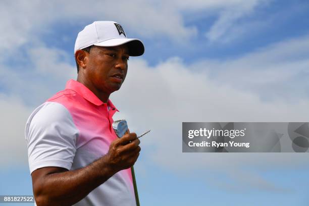 Tiger Woods walks to his bag following a shot during practice for the Hero World Challenge at Albany course on November 29, 2017 in Nassau, Bahamas.