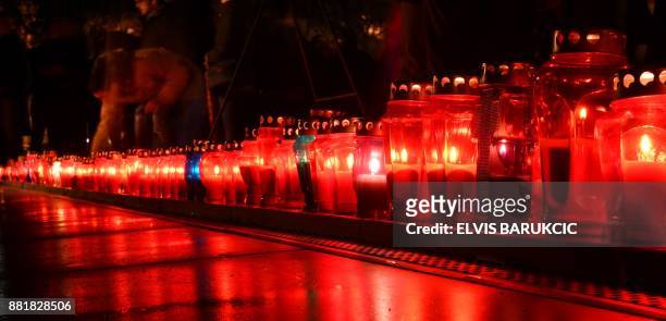Bosnian Croats and residents of Mostar, light candles in in tribute to General Slobodan Praljak, on November 29 after Bosnian Croat war criminal took...