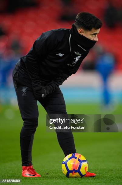 Philippe Coutinho of Liverpool looks on as he warms up prior to the Premier League match between Stoke City and Liverpool at Bet365 Stadium on...