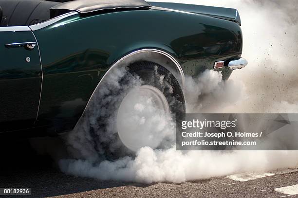 camaro smoking tire - joseph o. holmes stock pictures, royalty-free photos & images