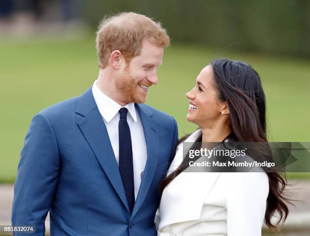 Prince Harry and Meghan Markle attend an official photocall to announce their engagement at The Sunken Gardens, Kensington Palace on November 27,...