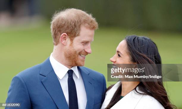 Prince Harry and Meghan Markle attend an official photocall to announce their engagement at The Sunken Gardens, Kensington Palace on November 27,...