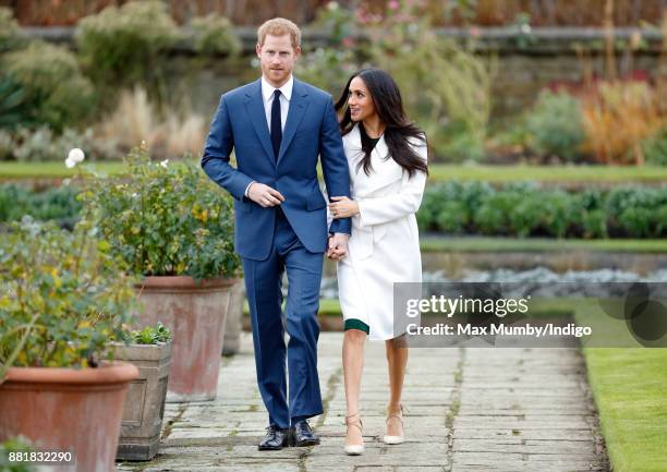 Prince Harry and Meghan Markle attend an official photocall to announce their engagement at The Sunken Gardens, Kensington Palace on November 27,...