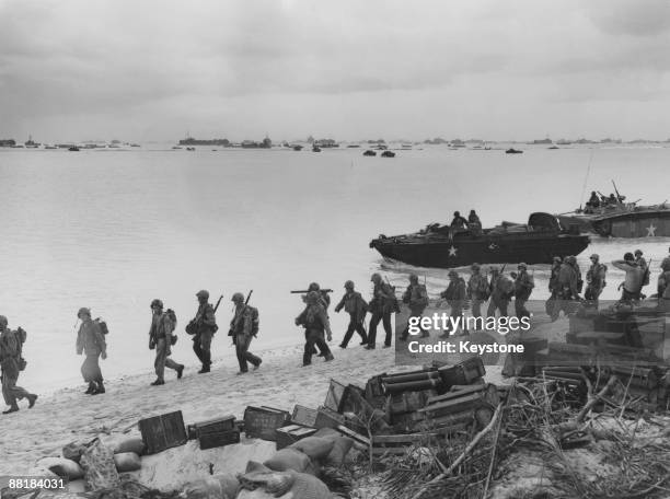 American troops land on the beaches of Saipan Island during the Battle of Saipan in the Northern Mariana Islands, June 1944. Among the landing craft...