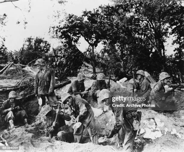 American Marines dig in, in preparation for their first night on Saipan Island, during the Battle of Saipan in the Northern Mariana Islands, 1944.