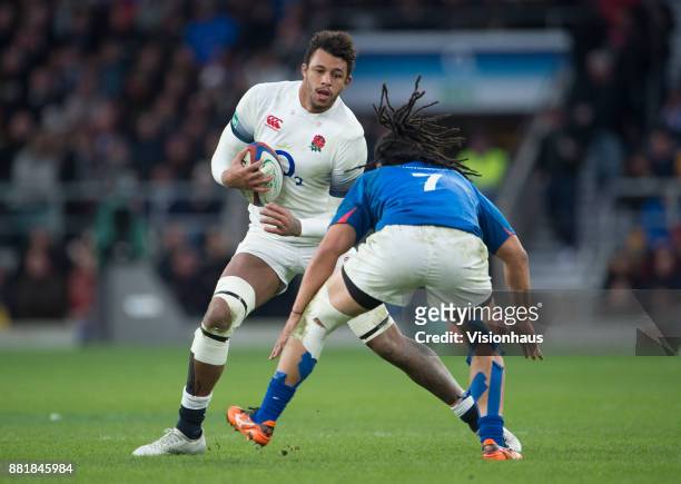 Courtney Lawes of England is tackled by TJ Ioane of Samoa during the Old Mutual Wealth Series autumn international match between England and Samoa at...