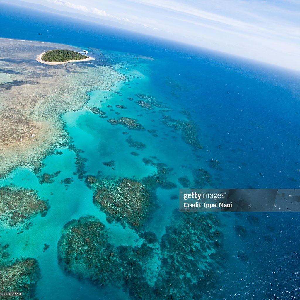 Flying over green island 