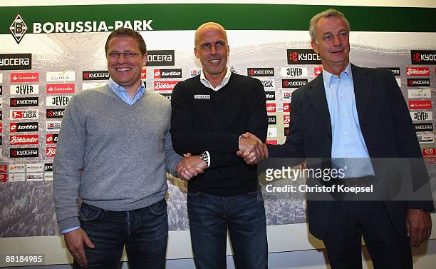 Sporting director Max Eberl, head coach Michael Frontzeck and vice-president Rainer Bohnhof pose during the presentation of the new head coach of...
