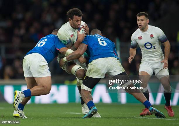 Courtney Lawes of England is tackled by Manu Leiataua and Piula Fa'asalele od Samoa during the Old Mutual Wealth Series autumn international match...