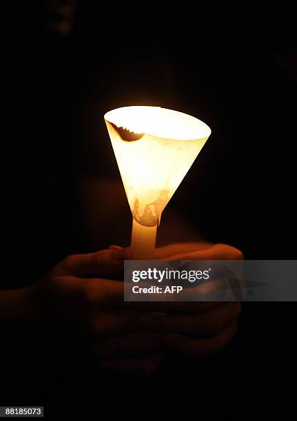 Students from the University of Hong Kong hold a candlelight vigil next to the pillar of shame to mark the 20th anniversary of the Beijing Tiananmen...