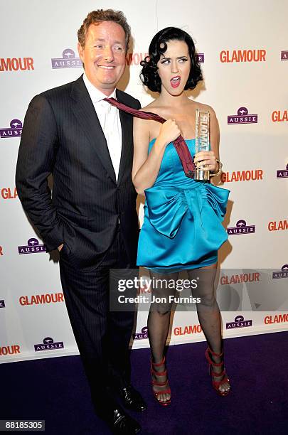 Piers Morgan and singer Katy Perry poses with the Aussie Hair Newcomer Award during the Glamour Women of the Year Awards 2009 at Berkeley Square...