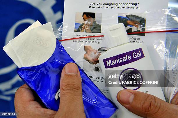 This picture taken on on June 3, 2009 shows a bottle of hand cleansing gel and paper tissue used as part of a hygene kit distributed to delegates at...