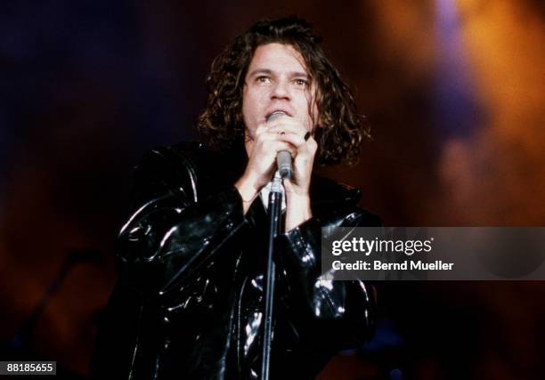 Michael Hutchence lead singer of Australian band INXS performs on stage at the Festhalle in Frankfurt, Germany on November 6 1990.