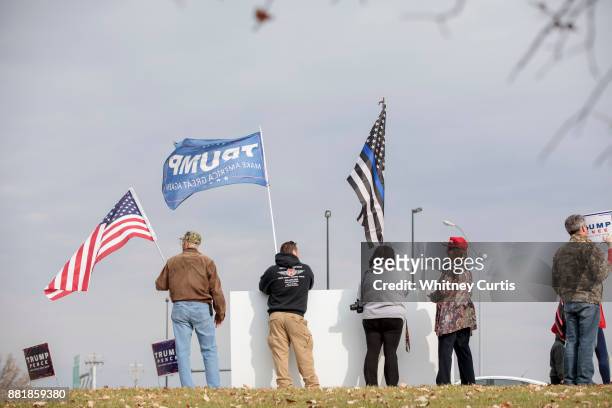 Trump supporters gather outside the St. Charles Convention Center before U.S. President Donald Trump arrives to speak on November 29, 2017 in St....