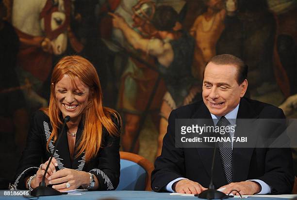 Italian Prime Minister Silvio Berlusconi and minister for tourism Michela Vittoria Brambilla give a joint press conference on June 3, 2009 at Palazzo...