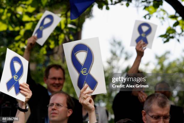 Employees attend a warning strike in front of the ECB headquarters on June 3, 2009 in Frankfurt am Main, Germany. European Central Bank staff hold...