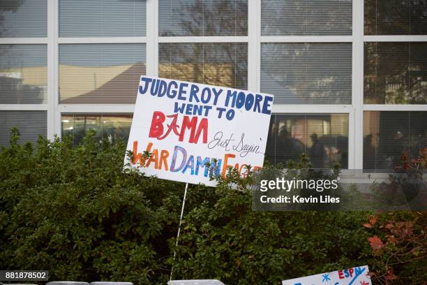 View of sign that reads JUDGE ROY MOORE WENT TO BAMA JUST SAYIN' WAR DAMN EAGLE outside Jordan-Hare Stadium before Auburn vs Alabama game. Auburn, AL...