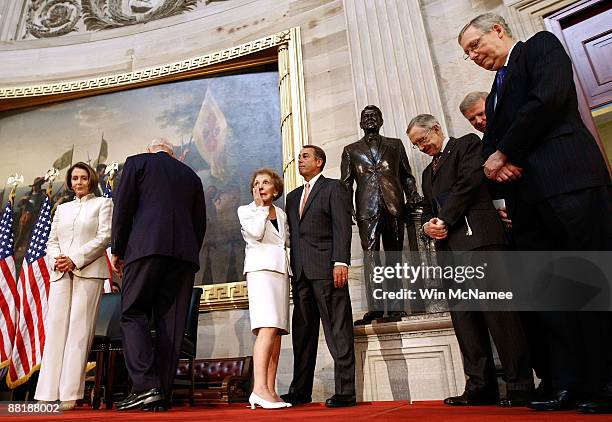 Former U.S. First lady Nancy Reagan wipes away a tear after the unveiling of a statue of former President Ronald Reagan in the Rotunda of the U.S....