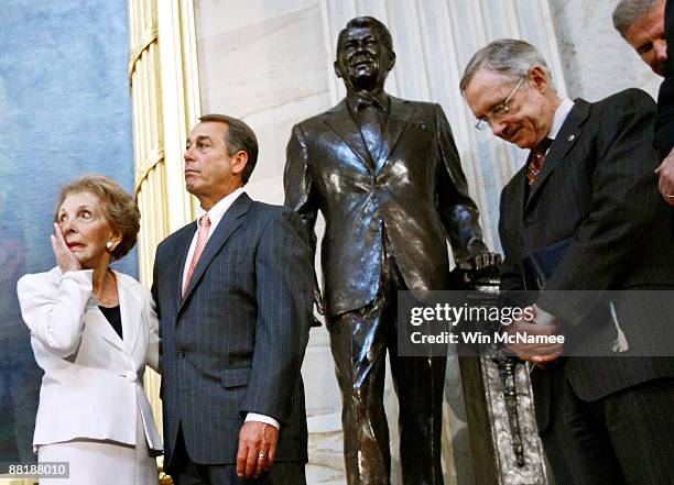 Former U.S. First lady Nancy Reagan wipes away a tear after the unveiling of a statue of former President Ronald Reagan in the Rotunda of the U.S....