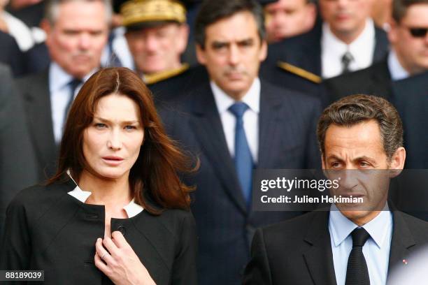 First Lady Carla Bruni-Sarkozy, French President Nicolas Sarkozy and French Prime Minister Francois Fillon leave the Notre Dame Cathedral after...