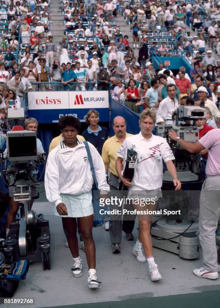 Steffi Graf of Germany and Lori McNeil of the USA walk on to court ahead of their Women's Semi-Final match in the US Open at the USTA National Tennis...