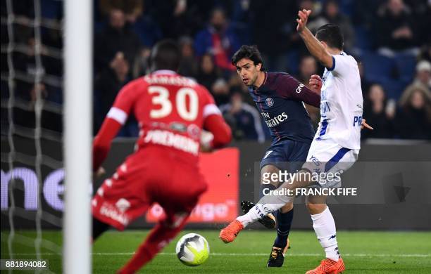 Paris Saint-Germain's Argentinian forward Javier Pastore kicks the ball in front of Troyes' Malian goalkeeper Mamadou Samassa during the French L1...