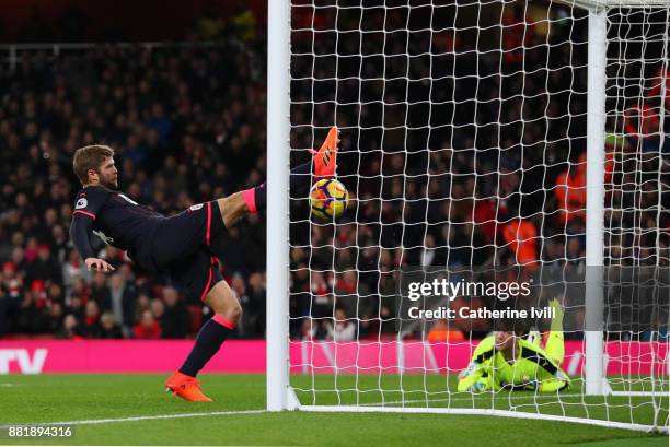 Martin Cranie of Huddersfield Town clears off the line during the Premier League match between Arsenal and Huddersfield Town at Emirates Stadium on...