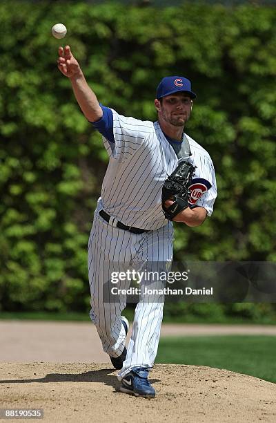 Starting pitcher Randy Wells of the Chicago Cubs warms-up in the bullpen before a game against the Houston Astros on May 16, 2009 at Wrigley Field in...