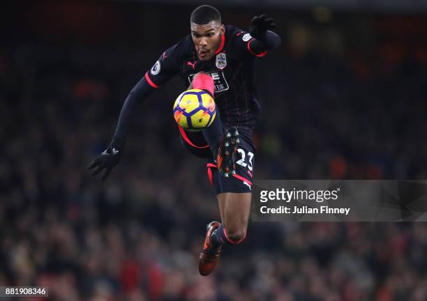 Collin Quaner of Huddersfield Town controls the ball in mid air during the Premier League match between Arsenal and Huddersfield Town at Emirates...