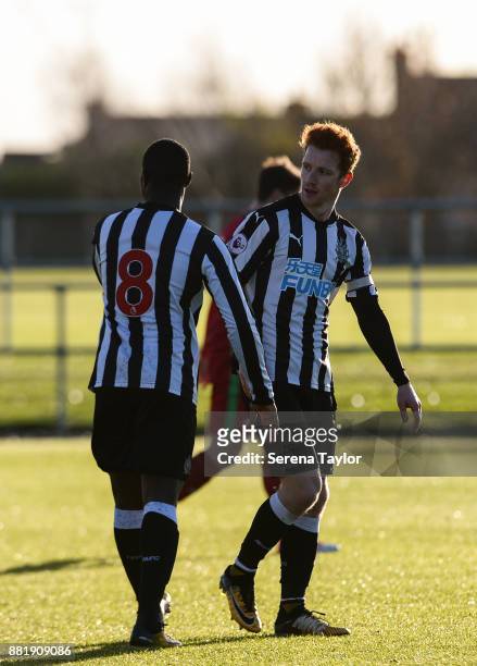 Jack Colback of Newcastle celebrates with teammate Henri Saivet after he scores Newcastle's opening goal during the Premier League 2 match between...