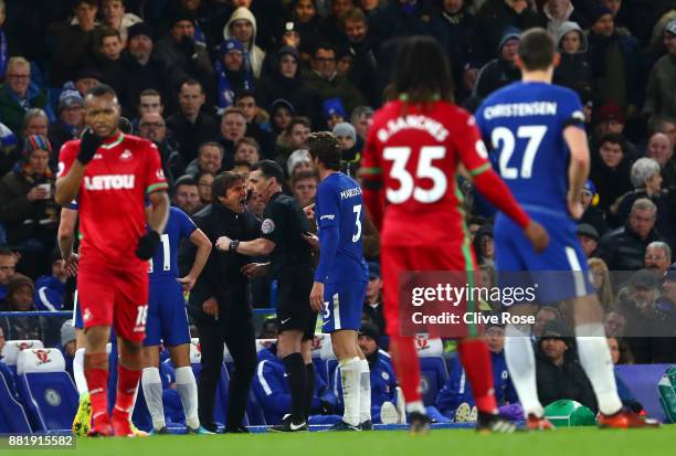 Antonio Conte, Manager of Chelsea argues with referee Neil Swarbrick during the Premier League match between Chelsea and Swansea City at Stamford...