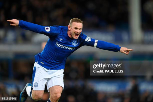 Everton's English striker Wayne Rooney celebrates scoring their second goal during the English Premier League football match between Everton and West...