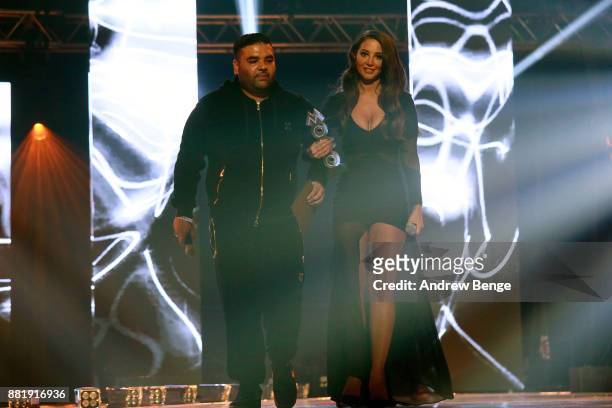 Naughty Boy and Tulisa Contostavlos on stage at the MOBO Awards at First Direct Arena Leeds on November 29, 2017 in Leeds, England.