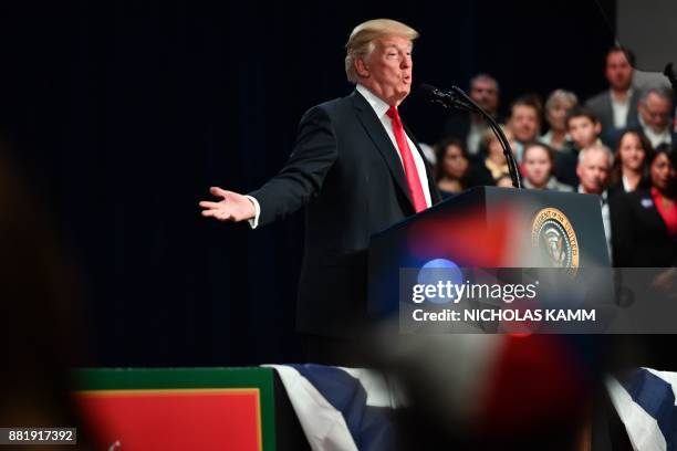 President Donald Trump speaks about taxes at the St. Charles, Missouri, Convention Center on November 29, 2017. / AFP PHOTO / Nicholas Kamm