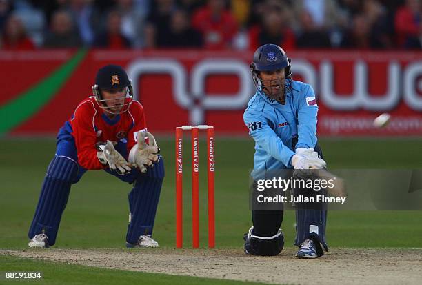 Murray Goodwin of Sussex hits out as Adam Wheater of Essex watches on during The Twenty20 Cup match between Essex Eagles and Sussex Sharks at The...