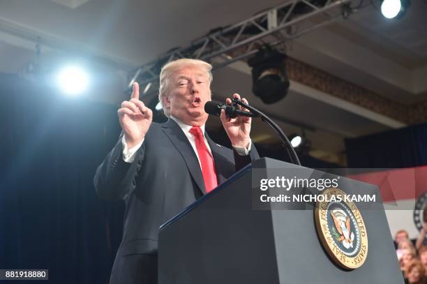 President Donald Trump speaks about taxes at the St. Charles, Missouri, Convention Center on November 29, 2017. / AFP PHOTO / Nicholas Kamm