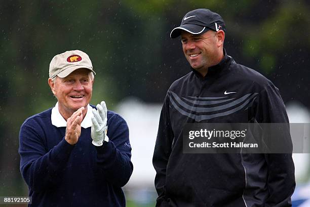 Jack Nicklaus and Stewart Cink wait on a green during a skins game prior to the start of the Memorial Tournament at the Muirfield Village Golf Club...