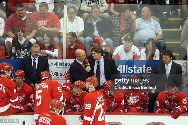 Reporter Pierre McGuire interviews head coach Mike Babcock of the Detroit Red Wings during the game against the Pittsburgh Penguins during Game Two...