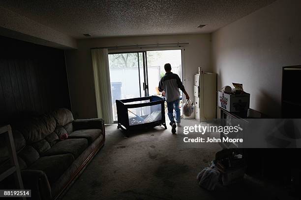 An eviction team removes bags of belongings from an apartment on June 3, 2009 in Lafayette, Colorado. The renters had failed to make their monthly...