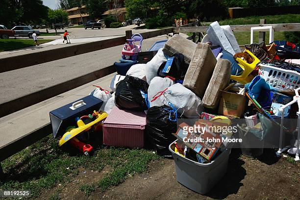 Family's belongings sit next to the street after an eviction team removed them from an apartment on June 3, 2009 in Lafayette, Colorado. The renters...