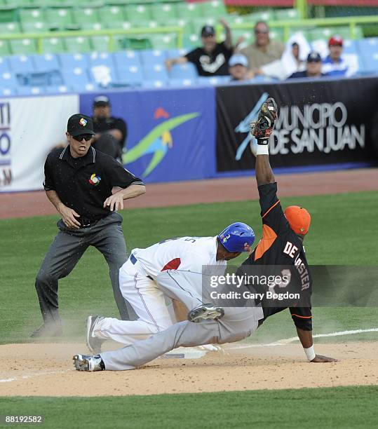 Yurendell DeCaster signals to the umpire for the out during game one of Pool D, between the Dominican Republic and the Netherlands during the the...