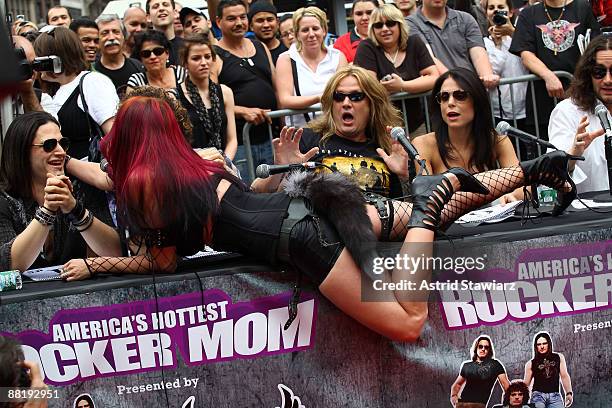 Hottest Rocker Mom Winner Debra Diamant performs to Sebastian Bach and Bethenny Frankel at America's Hottest Rocker Mom Contest at Madison Square...