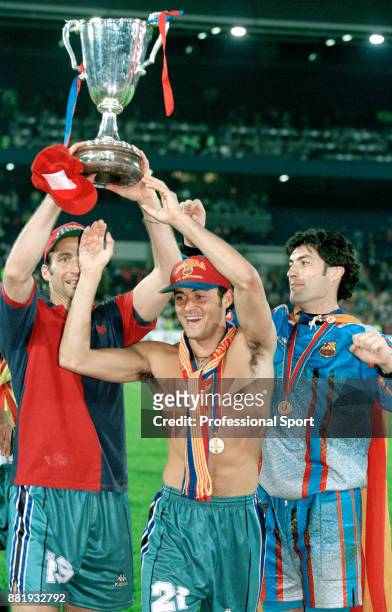 Juan Antonio Pizzi , Luis Enrique and Vitor Baia of FC Barcelona celebrate with the trophy after winning the European Cup Winners' Cup against Paris...