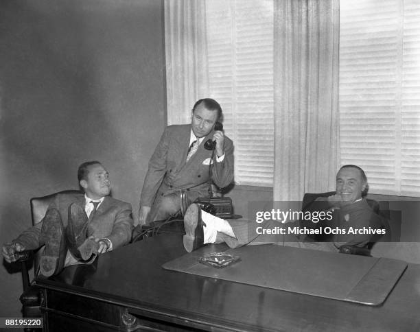 The founders of Capitol Records pose for a photo in their Sunset Blvd offices on July 21, 1943 in Los Angeles, California.