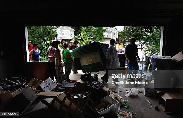 An eviction team removes belongings left behind during foreclosure proceedings on a home June 3, 2009 in Lafayette, Colorado. The owners had stopped...