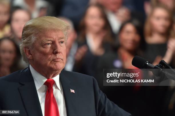 President Donald Trump speaks about taxes at the St. Charles, Missouri, Convention Center on November 29, 2017. / AFP PHOTO / Nicholas Kamm